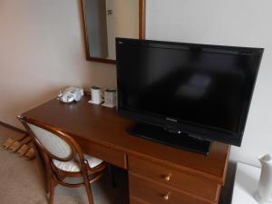 Telewizja i/lub zestaw kina domowego w obiekcie Select Inn Mishima