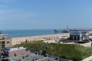 a view of a beach with people on it at Hotel Andante aan Zee in Scheveningen