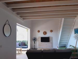 TV o dispositivi per l'intrattenimento presso Appartement neuf a 150 metres de la mer wifi