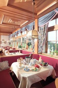 a dining room with a table with food on it at Wienerwaldhof Rieger in Tullnerbach-Lawies