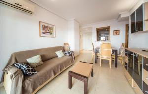 a living room with a couch and a table at Beautiful Apartment In Orpesa Del Mar in Oropesa del Mar