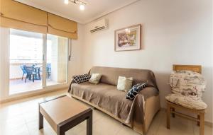 a living room with a couch and a table at Beautiful Apartment In Orpesa Del Mar in Oropesa del Mar