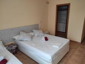 A bed or beds in a room at Villa El Mirador