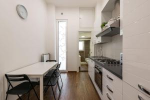 Kuchyň nebo kuchyňský kout v ubytování Central loft full comfort