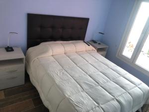 Cama ou camas em um quarto em Mirador del Kaiken