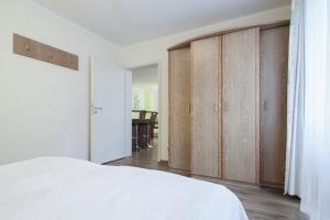 Ένα ή περισσότερα κρεβάτια σε δωμάτιο στο Residenz Seestern Wohnung 22 +30 φωτογραφίες