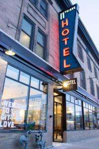 a building with a sign for a music store at 11th Avenue Hostel in Denver