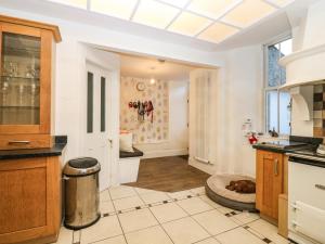 a kitchen with white walls and a ceiling at Mavisbank in Peterhead +35 photos