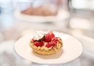 a small dessert on a plate with strawberries on it at Viking Line ferry Gabriella - Cruise Helsinki-Stockholm-Helsinki in Helsinki