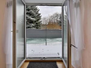 a large glass door with a window in a room at POD BZEM in Szczytna