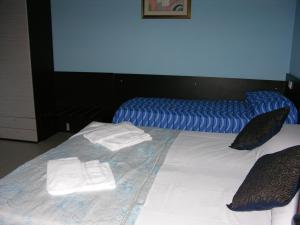 Postel nebo postele na pokoji v ubytování B&B Angolo Felice