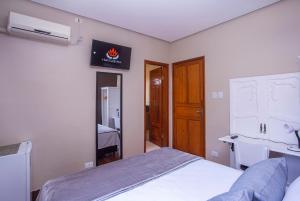Postel nebo postele na pokoji v ubytování Hotel Gambrinus