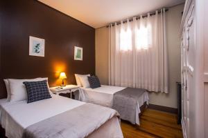 Postel nebo postele na pokoji v ubytování Hotel Gambrinus