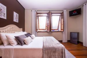 Postel nebo postele na pokoji v ubytování Hotel Gambrinus