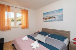 Posteľ alebo postele v izbe v ubytovaní Beach Apartment Milena