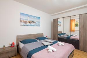 Posteľ alebo postele v izbe v ubytovaní Beach Apartment Milena