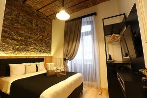 Krevet ili kreveti u jedinici u okviru objekta Kamil Bey Suites Hotel