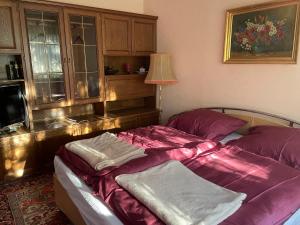 A bed or beds in a room at Suburb Hostel