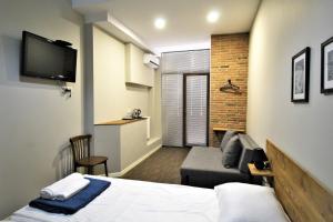TV a/nebo společenská místnost v ubytování Hotel Loft