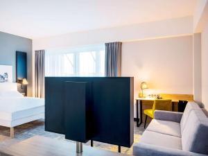 Posteľ alebo postele v izbe v ubytovaní ibis styles Grudziadz