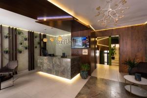 a lobby with a reception desk in a building at Sofa Boutique Hotel & SPA in Sumy