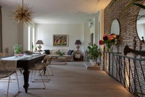 a living room with a piano and a couch at Villa Barbara in San Giovanni in Marignano +52 photos