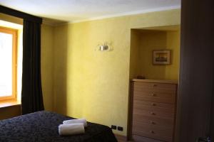 A bed or beds in a room at Suite - La Casa del Maestro