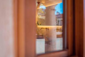 a view of a bathroom through a window at CANDIL SUITE Realejo in Granada +51 photos
