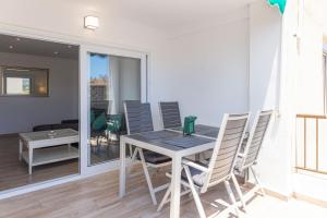 a dining room with a table and chairs at L'Ancora Beach in Jávea