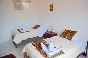 Postel nebo postele na pokoji v ubytování Arena Blanca Eco Hotel