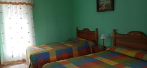 Postel nebo postele na pokoji v ubytování Casas Rurales Tiscar