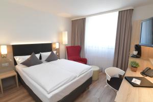 Postel nebo postele na pokoji v ubytování Hotel Krone