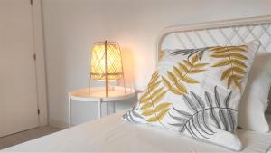 En eller flere senge i et værelse på San Nicolás - tranquilidad y comodidad en el centro de Murcia