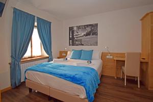 A bed or beds in a room at Affittacamere da Annarè