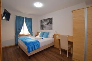 A bed or beds in a room at Affittacamere da Annarè