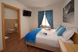 A bed or beds in a room at Affittacamere da Annarè
