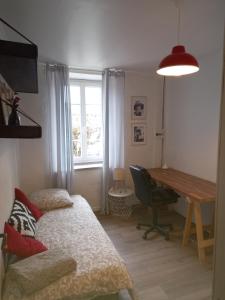Ένα ή περισσότερα κρεβάτια σε δωμάτιο στο Maison cosy à Ury