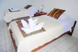 Postel nebo postele na pokoji v ubytování Arena Blanca Eco Hotel