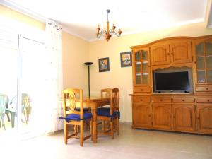 Televízia a/alebo spoločenská miestnosť v ubytovaní Miami Residencial LEK