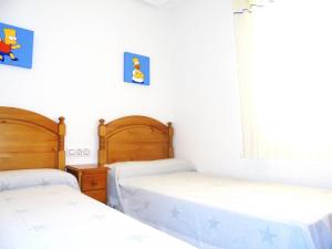 Posteľ alebo postele v izbe v ubytovaní Miami Residencial LEK