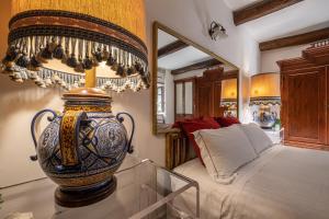 A bed or beds in a room at Corte Cristina & Suites
