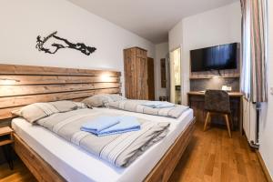 Postel nebo postele na pokoji v ubytování Gasthof Rebstock