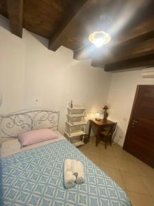 a bedroom with a bed and a lamp at L'Antica Torre in Cagliari