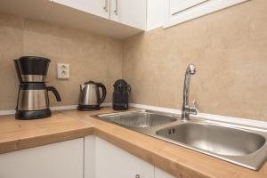 A kitchen or kitchenette at Athens Dreams & Suites Apartments