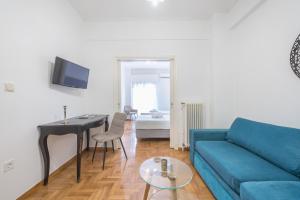 A television and/or entertainment centre at Athens Dreams & Suites Apartments