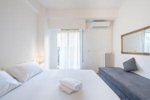 Postel nebo postele na pokoji v ubytování Athens Dreams & Suites Apartments