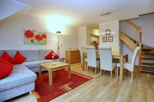 Posezení v ubytování Feriendorf Papillon Wohnung 06-7