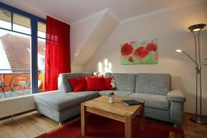 Posezení v ubytování Feriendorf Papillon Wohnung 06-7