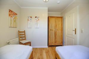Postel nebo postele na pokoji v ubytování Feriendorf Papillon Wohnung 06-7