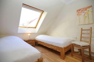 Postel nebo postele na pokoji v ubytování Feriendorf Papillon Wohnung 06-7